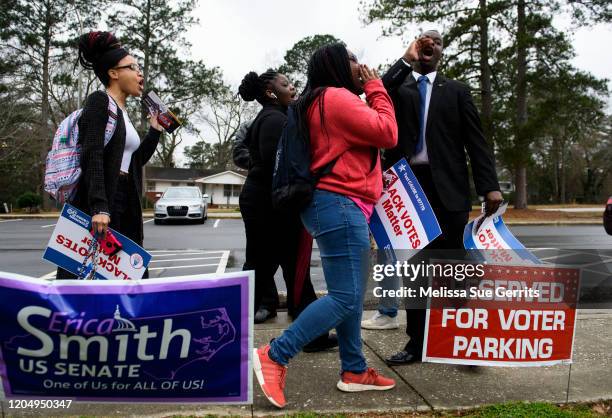 Fayetteville State University student NAACP chapter President Ty Hamer leads a call as students walk to Smith Recreation Center to vote on March 3,...