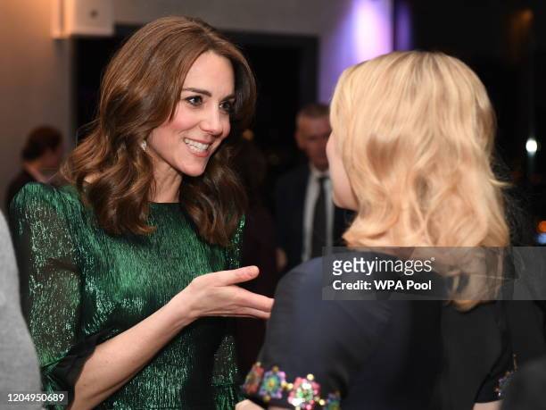 Catherine, Duchess of Cambridge speaks to guests during a reception with Prince William, Duke of Cambridge, hosted by the British Ambassador to...