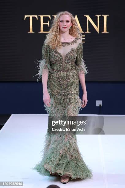 Model walks the runway wearing Bebe's and Liz's presents TERANI Couture during NYFW Powered By hiTechMODA on February 08, 2020 in New York City.