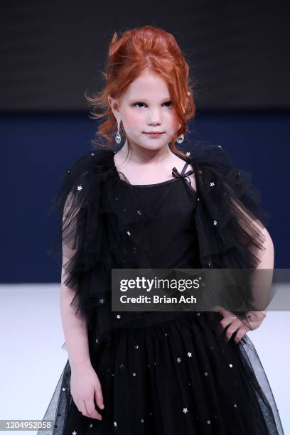 Model walks the runway wearing Bebe's and Liz's presents TERANI Couture during NYFW Powered By hiTechMODA on February 08, 2020 in New York City.