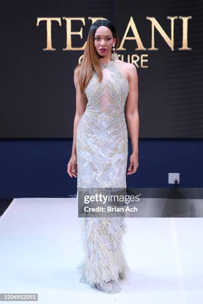 Model walks the runway wearing Bebe's and Liz's presents TERANI Couture during NYFW Powered By hiTechMODA on February 08, 2020 in New York City.