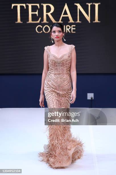 Model walks the runway wearing Bebe's and Liz's presents TERANI Couture during NYFW Powered By hiTechMODA on February 08, 2020 in New York City.