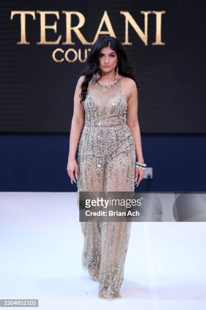 Model walks the runway wearing Bebe's and Liz's presents TERANI Couture during NYFW Powered By hiTechMODA on February 08, 2020 in New York City.