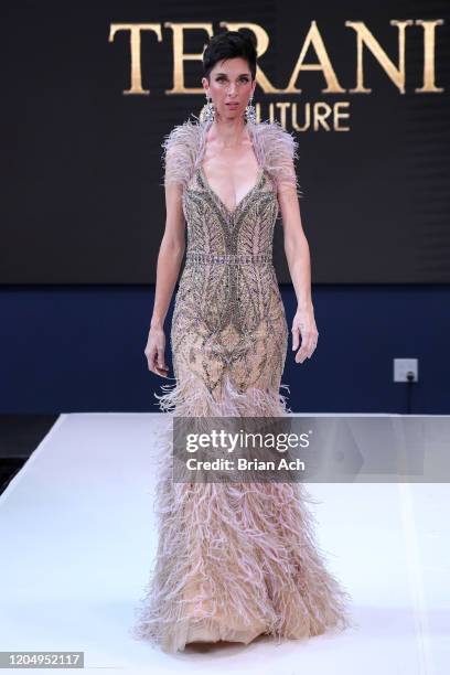 Model walks the runway wearing Bebe's and Liz's presents TERANI Couture during NYFW Powered By hiTechMODA on February 08, 2020 in New York City.