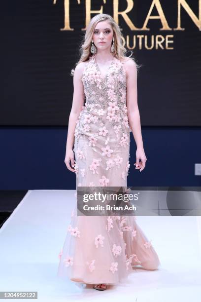 Model walks the runway wearing Bebe's and Liz's presents TERANI Couture during NYFW Powered By hiTechMODA on February 08, 2020 in New York City.