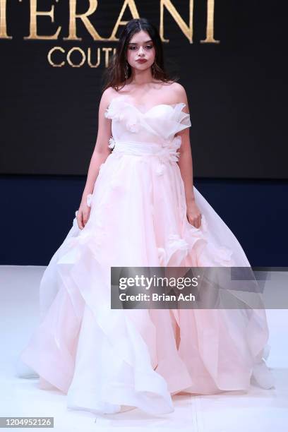 Model walks the runway wearing Bebe's and Liz's presents TERANI Couture during NYFW Powered By hiTechMODA on February 08, 2020 in New York City.