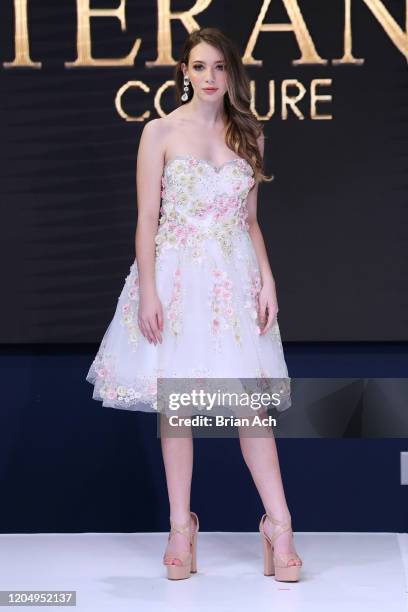 Model walks the runway wearing Bebe's and Liz's presents TERANI Couture during NYFW Powered By hiTechMODA on February 08, 2020 in New York City.