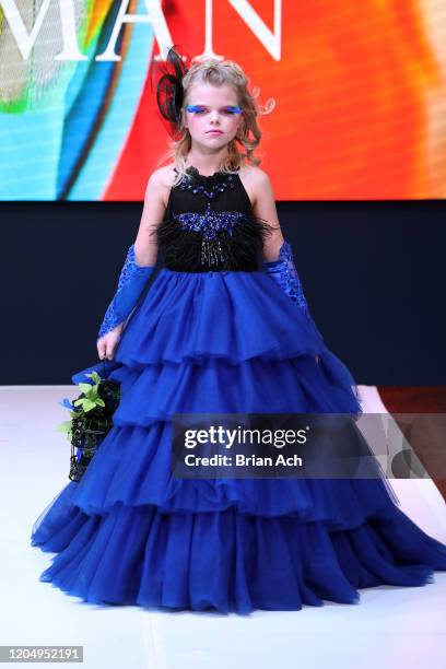 Model walks the runway wearing Mila Hoffman Couture during NYFW Powered By hiTechMODA on February 08, 2020 in New York City.