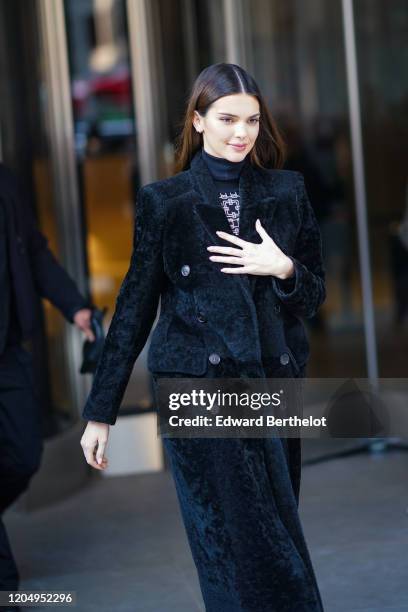 Kendall Jenner wears a turtleneck pullover, a black fluffy long coat, outside Longchamp, during New York Fashion Week Fall-Winter 2020, on February...