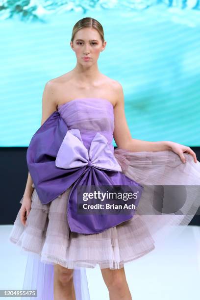 Model walks the runway wearing MM Milano Couture during NYFW Powered By hiTechMODA on February 08, 2020 in New York City.