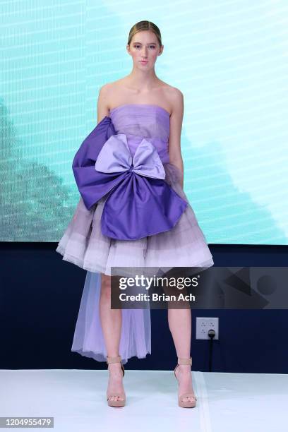 Model walks the runway wearing MM Milano Couture during NYFW Powered By hiTechMODA on February 08, 2020 in New York City.