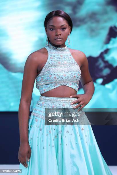 Model walks the runway wearing MM Milano Couture during NYFW Powered By hiTechMODA on February 08, 2020 in New York City.