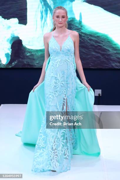 Model walks the runway wearing MM Milano Couture during NYFW Powered By hiTechMODA on February 08, 2020 in New York City.