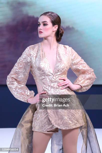 Model walks the runway wearing MM Milano Couture during NYFW Powered By hiTechMODA on February 08, 2020 in New York City.