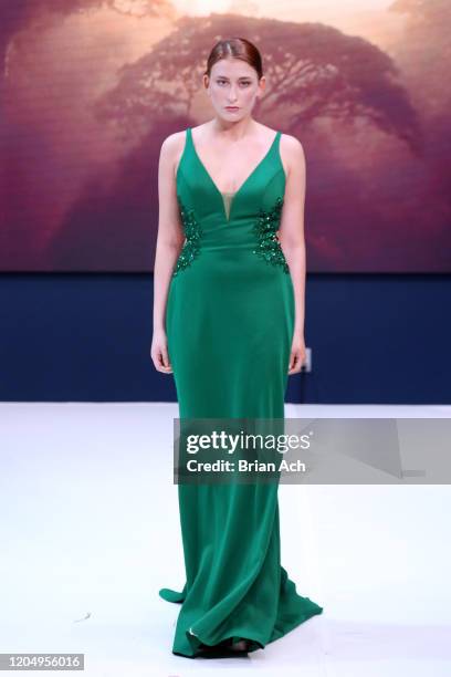 Model walks the runway wearing MM Milano Couture during NYFW Powered By hiTechMODA on February 08, 2020 in New York City.