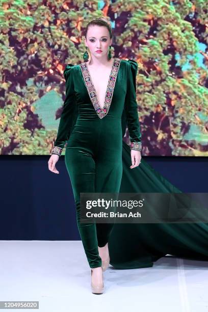 Model walks the runway wearing MM Milano Couture during NYFW Powered By hiTechMODA on February 08, 2020 in New York City.