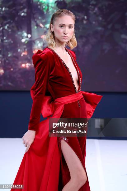 Model walks the runway wearing MM Milano Couture during NYFW Powered By hiTechMODA on February 08, 2020 in New York City.