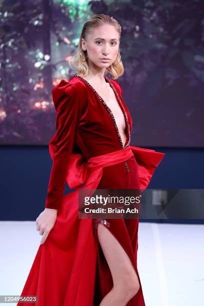 Model walks the runway wearing MM Milano Couture during NYFW Powered By hiTechMODA on February 08, 2020 in New York City.