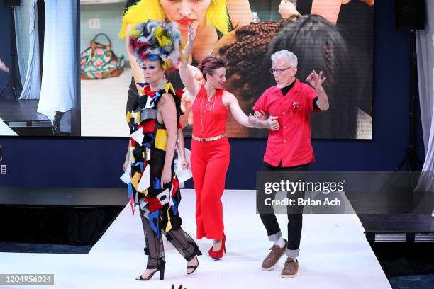 The designers walk the runway wearing Gulick & Ybarra Wearable Art during NYFW Powered By hiTechMODA on February 08, 2020 in New York City.