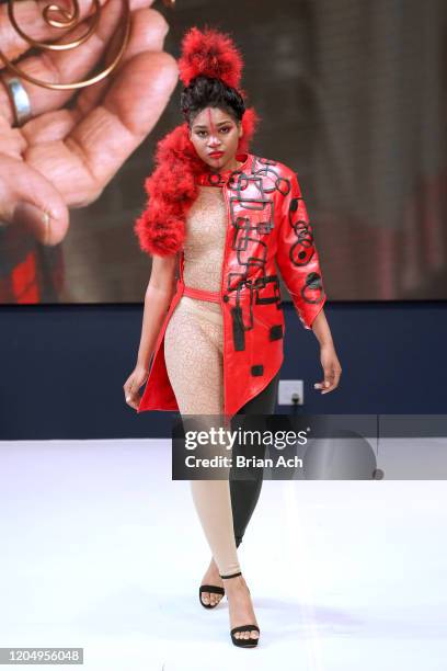 Model walks the runway wearing Gulick & Ybarra Wearable Art during NYFW Powered By hiTechMODA on February 08, 2020 in New York City.