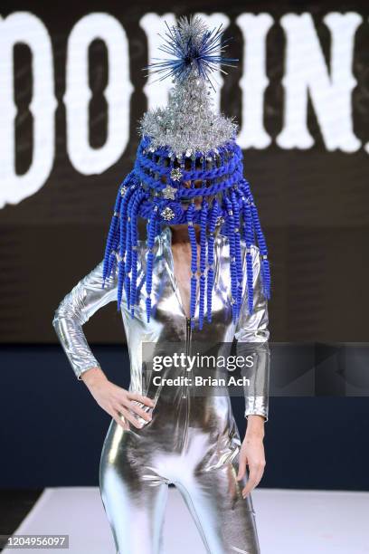 Model walks the runway wearing Dominion Couture Costume Design during NYFW Powered By hiTechMODA on February 08, 2020 in New York City.