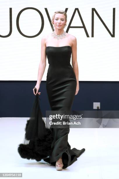 Model Lou Schieffelin walks the runway wearing Bebe's and Liz's presents JOVANI, Special Showcase by Celebrity Jeweler Mike Nekta New York during...