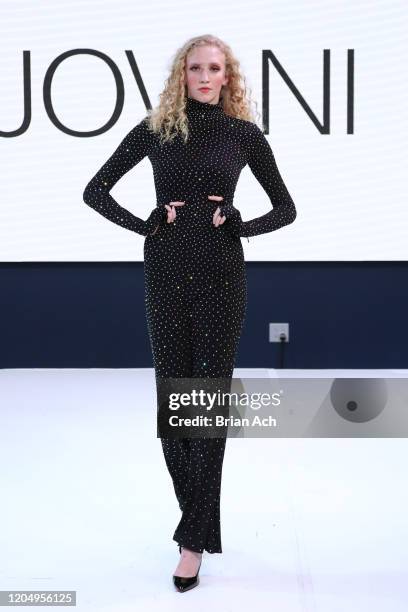 Model walks the runway wearing Bebe's and Liz's presents JOVANI during NYFW Powered By hiTechMODA on February 08, 2020 in New York City.