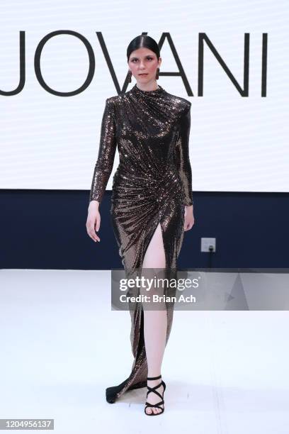 Model walks the runway wearing Bebe's and Liz's presents JOVANI during NYFW Powered By hiTechMODA on February 08, 2020 in New York City.