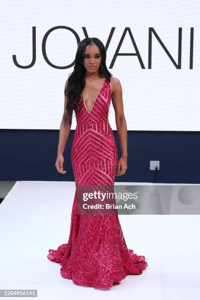 Model walks the runway wearing Bebe's and Liz's presents JOVANI during NYFW Powered By hiTechMODA on February 08, 2020 in New York City.