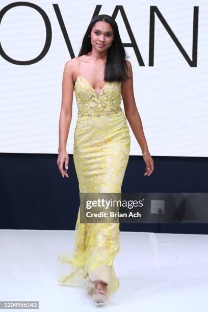 Model walks the runway wearing Bebe's and Liz's presents JOVANI during NYFW Powered By hiTechMODA on February 08, 2020 in New York City.