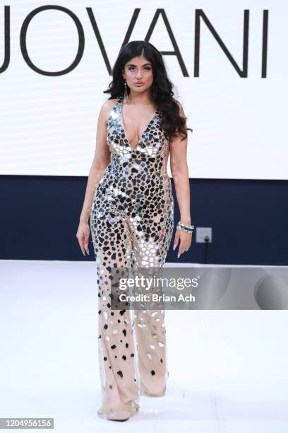 Model walks the runway wearing Bebe's and Liz's presents JOVANI during NYFW Powered By hiTechMODA on February 08, 2020 in New York City.