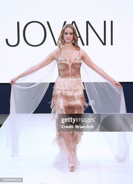 Model walks the runway wearing Bebe's and Liz's presents JOVANI during NYFW Powered By hiTechMODA on February 08, 2020 in New York City.