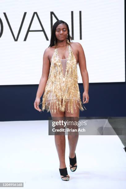 Model walks the runway wearing Bebe's and Liz's presents JOVANI during NYFW Powered By hiTechMODA on February 08, 2020 in New York City.