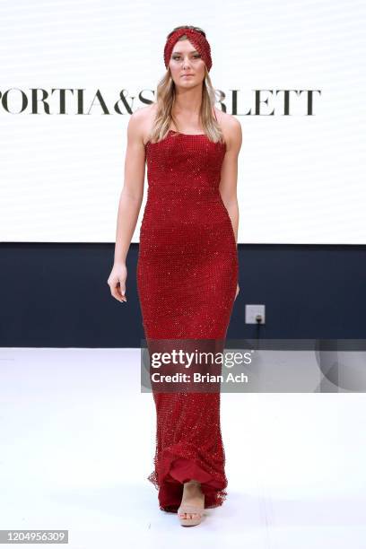 Model walks the runway wearing Portia & Scarlett Couture during NYFW Powered By hiTechMODA on February 08, 2020 in New York City.