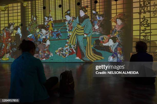 Visitors watch the multimedia installation during the "Japao em Sonhos" exhibition at the Japan House, in Sao Paulo, Brazil, on March 3, 2020.