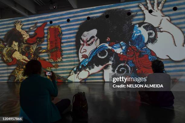 Visitors watch the multimedia installation during the "Japao em Sonhos" exhibition at the Japan House, in Sao Paulo, Brazil, on March 3, 2020.