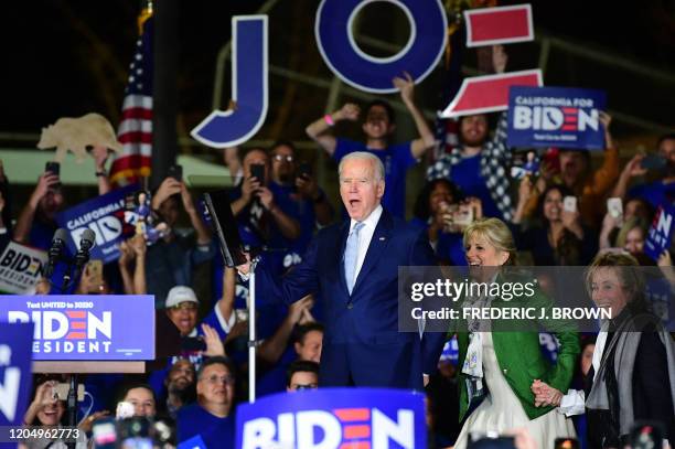 Democratic presidential hopeful former Vice President Joe Biden arrives onstage with his wife Jill and sister Valerie for a Super Tuesday event in...