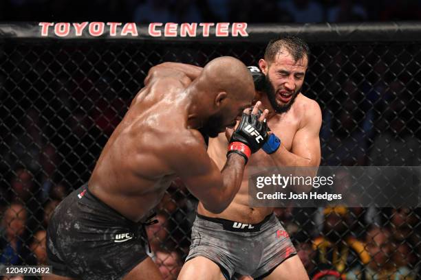 Jon Jones punches Dominick Reyes in their light heavyweight championship bout during the UFC 247 event at Toyota Center on February 08, 2020 in...