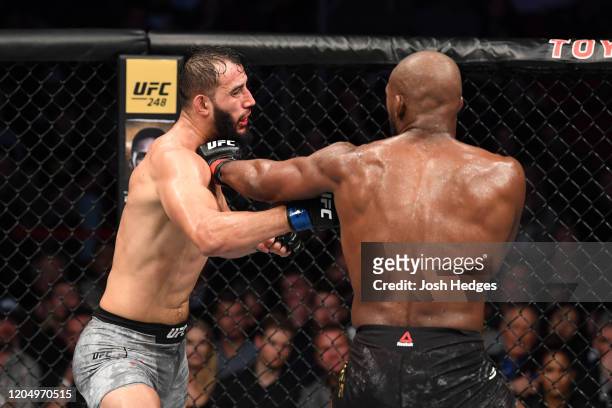 Jon Jones punches Dominick Reyes in their light heavyweight championship bout during the UFC 247 event at Toyota Center on February 08, 2020 in...