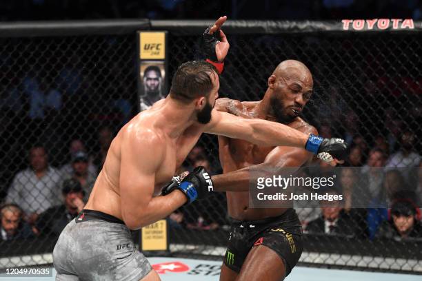 Dominick Reyes punches Jon Jones in their light heavyweight championship bout during the UFC 247 event at Toyota Center on February 08, 2020 in...