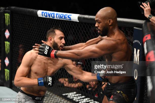 Dominick Reyes punches Jon Jones in their light heavyweight championship bout during the UFC 247 event at Toyota Center on February 08, 2020 in...