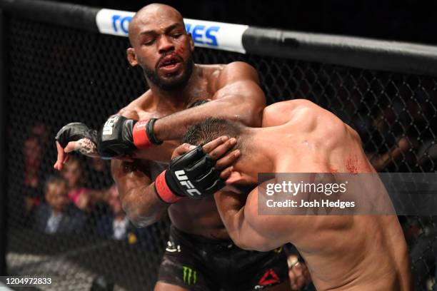 Jon Jones elbows Dominick Reyes in their light heavyweight championship bout during the UFC 247 event at Toyota Center on February 08, 2020 in...