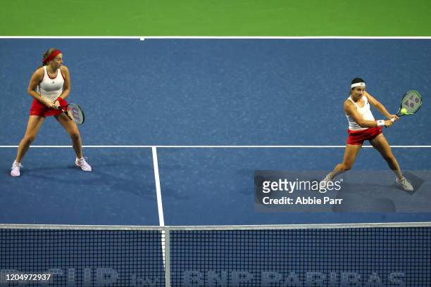 Anastasija Sevastova of Latvia hits the ball alongside Jelena Ostapenko of Latvia while competing against Sofia Kenin of USA and Bethanie...