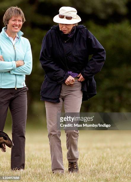 Princess Anne, The Princess Royal removes her trouser belt to use as a makeshift dog lead as she attends day 2 of The Festival of British Eventing at...