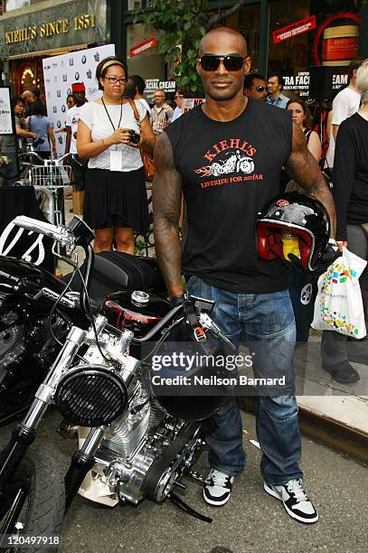 Tyson Beckford arrives on a BMW motorcycle at Kiehl's LifeRide for amfAR Block Party at Kiehl's Since 1851 New York Flagship Store on August 6, 2011...