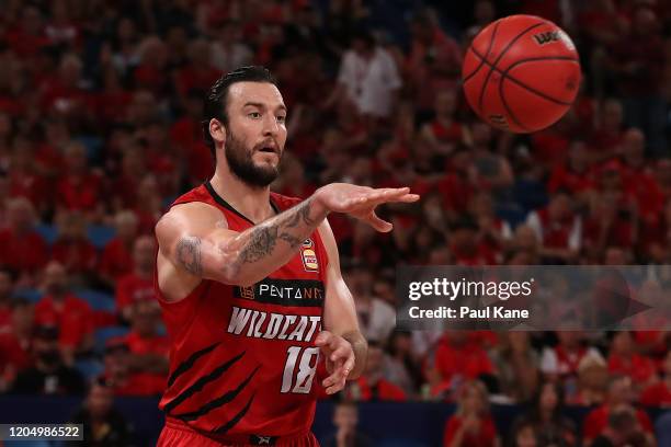 Miles Plumlee of the Wildcats passes the ball during the round 19 NBL match between the Perth Wildcats and the Brisbane Bullets at RAC Arena on...