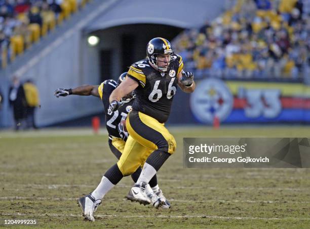 Offensive lineman Alan Faneca of the Pittsburgh Steelers blocks for running back Amos Zereoue during a game against the San Diego Chargers at Heinz...
