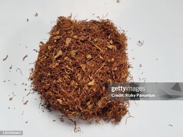 close-up of tobacco product on white background - tobacco product stockfoto's en -beelden