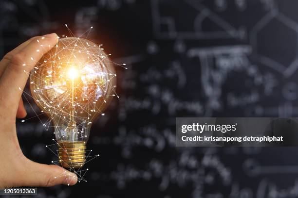 light bulbs concept,ideas of new ideas with innovative technology and creativity. - market intelligence imagens e fotografias de stock