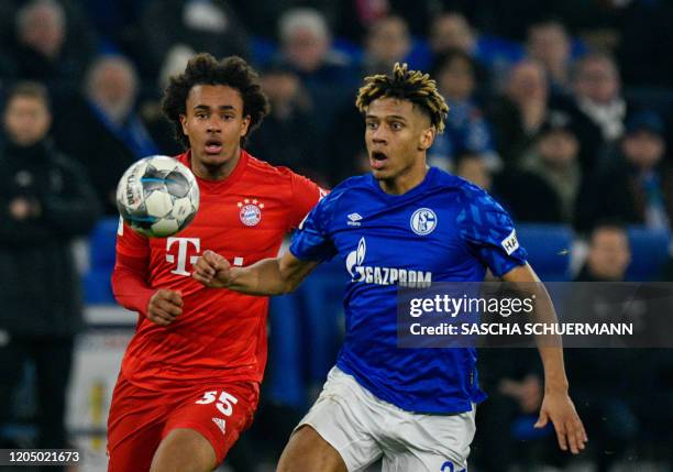 Bayern Munich's Dutch forward Joshua Zirkzee and Schalke's French defender Jean-Clair Todibo vie for the ball during the German Cup quarter-final...